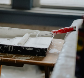 Paint roller in a tray with paint